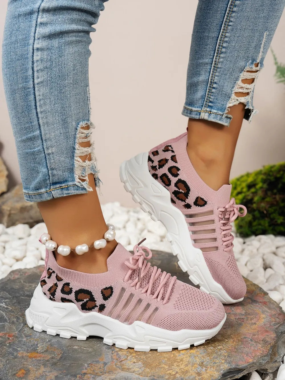 Dusty pink leopard mesh shoe worn on model